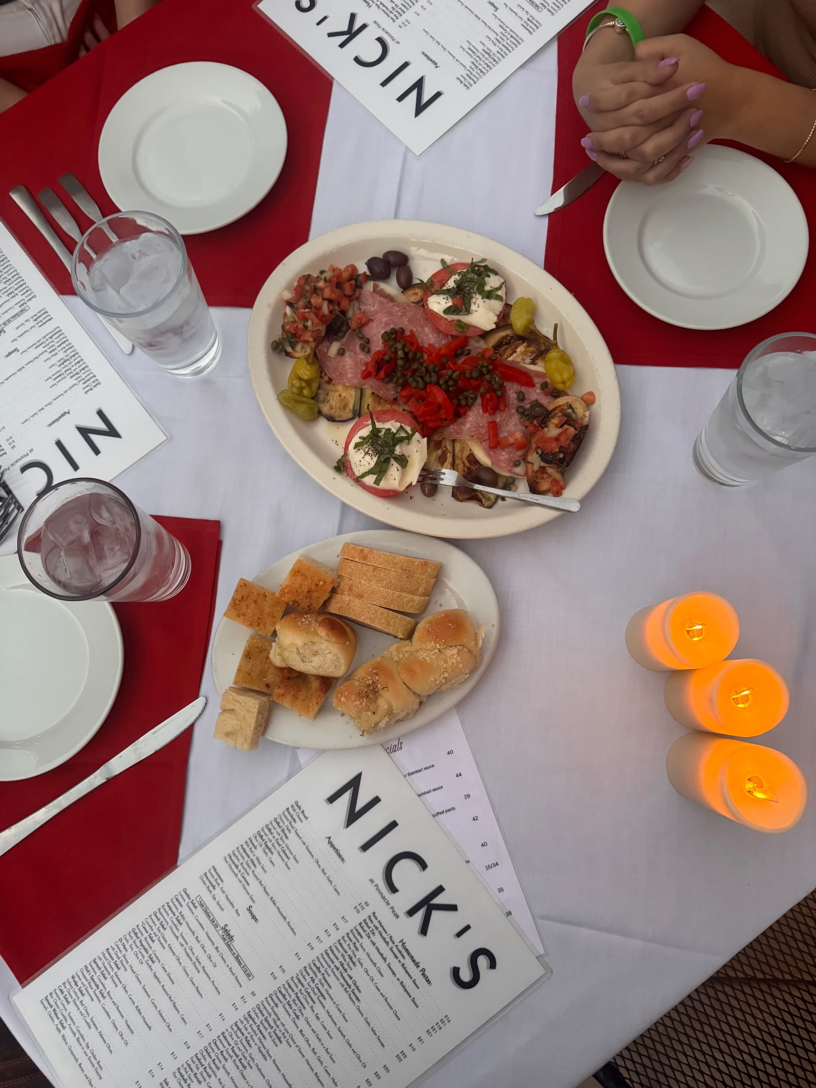 Catering antipasto spread with house bread on a Nick's table.